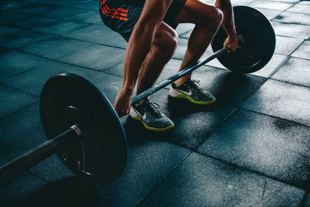 Man close up performing deadlift