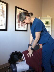 Dr. Kelley performing a chiropractic adjustment