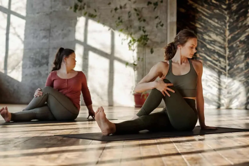 Photo of women practicing types of stretches together